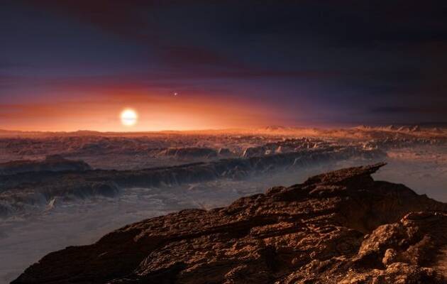 Aspecto que podría tener la superficie del planeta hallado. Al fondo, la estrella Próxima Centauri. AB. ESO / M. Kornmesser,Próxima Centauri, Próxima b